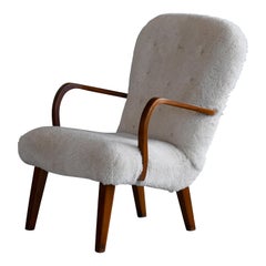 Midcentury Danish Clam Style Lounge Chair in Luxurious Sheepskin , 1950s