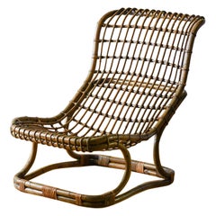 BP9 armchair in rattan by Tito Agnoli for Bonacina, 1970