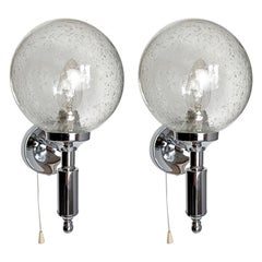1970s set of two wall lamps in chrome and Pulegoso Murano glass shades.