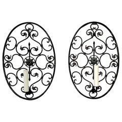 Pair of Mizner Style Neoclassic Pierced Bronze Oval Shield Sconces