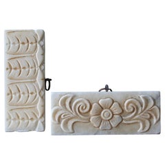 Coppia di elementi decorativi architettonici in marmo dell'inizio del XX secolo