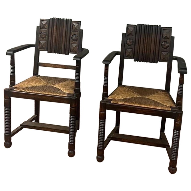 Pair of oak and straw armchairs "Dudouyt"