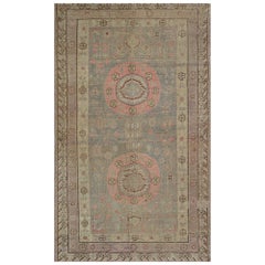Antiker Khotan-Teppich aus handgeknüpfter Wolle 