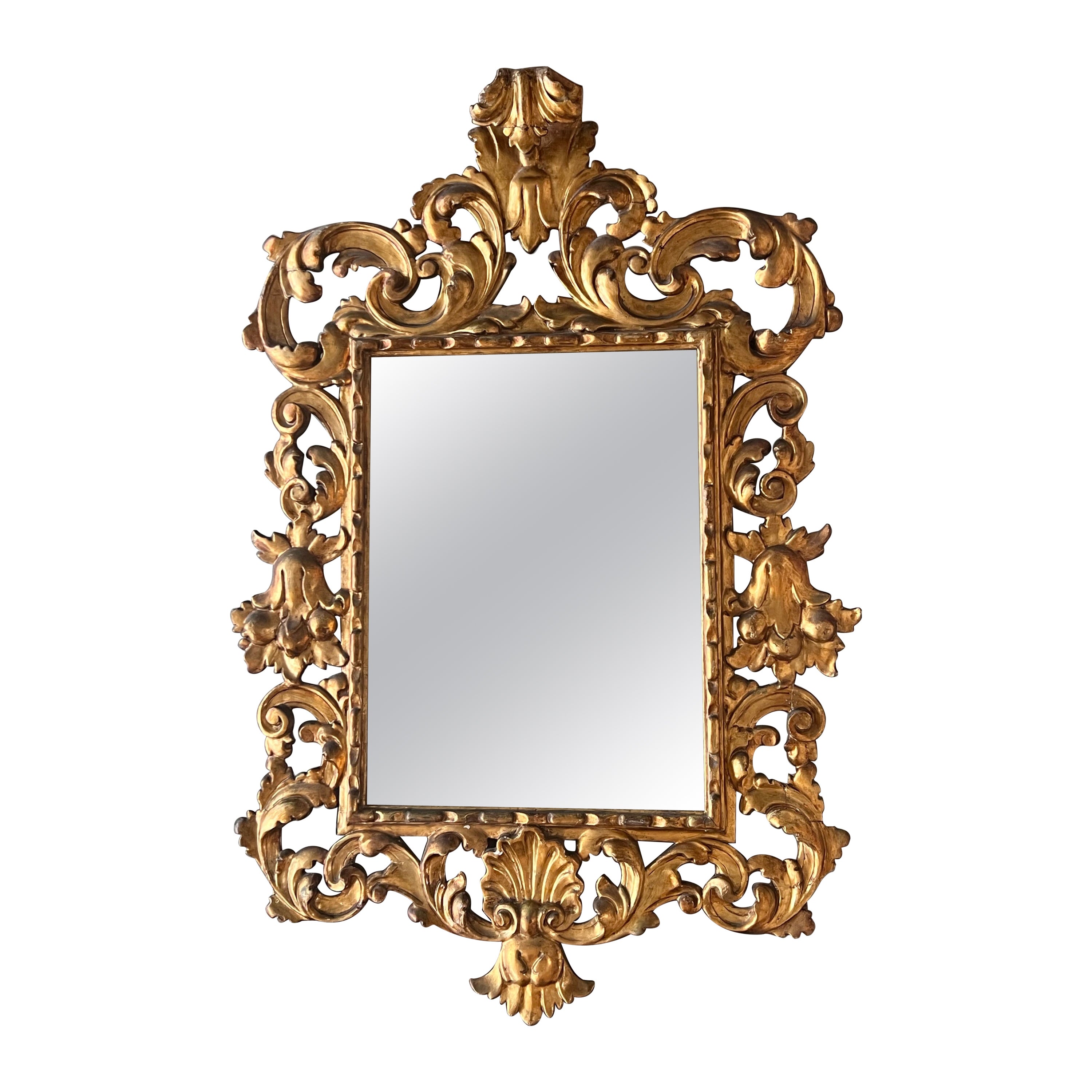 Miroir en bois sculpté et doré d'époque Empire (19e) en vente
