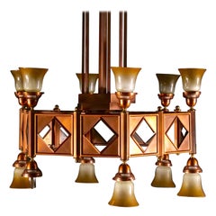 Grand lustre à 12 lumières en cuivre et laiton de style Art déco du milieu du siècle