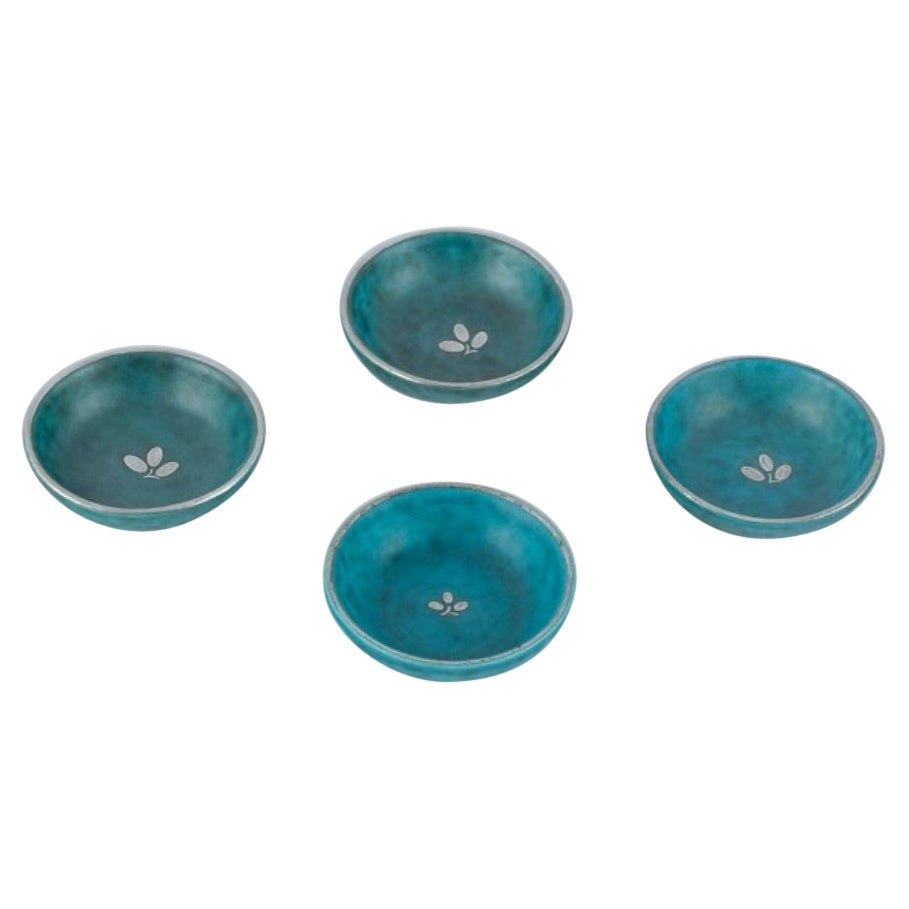 Wilhelm Kåge for Gustavsberg. Four small Argenta ceramic bowls with silver inlay For Sale
