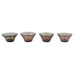 Simon Gate for Orrefors/Sandvik. Four bowls in smoked-coloured pressed glass