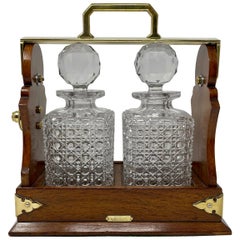 Antique English Golden Oak & Cut Crystal Two-Bottle Tantalus, Circa 1890.