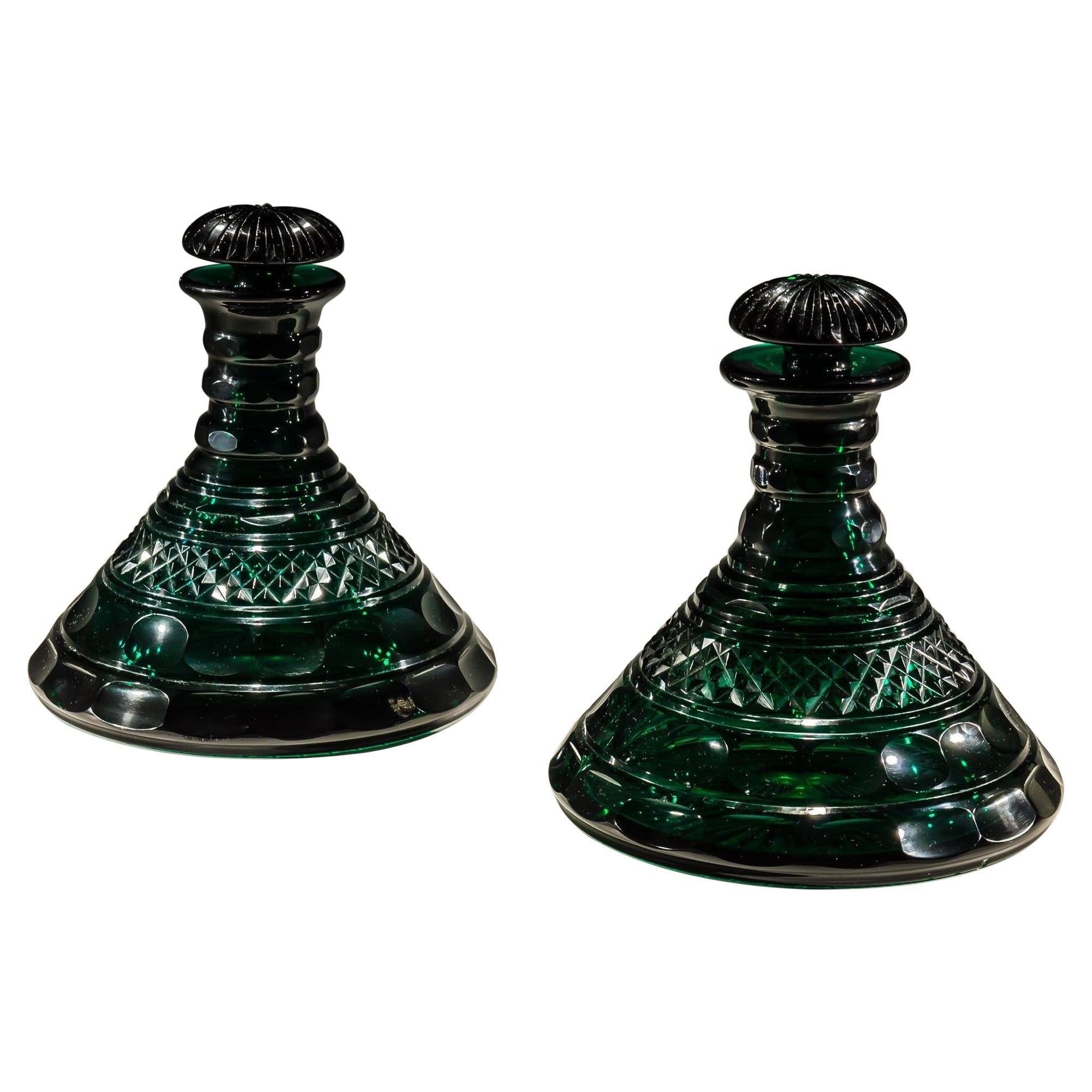 A Rare pair Of Heavily Cut Emerald Green Decanters