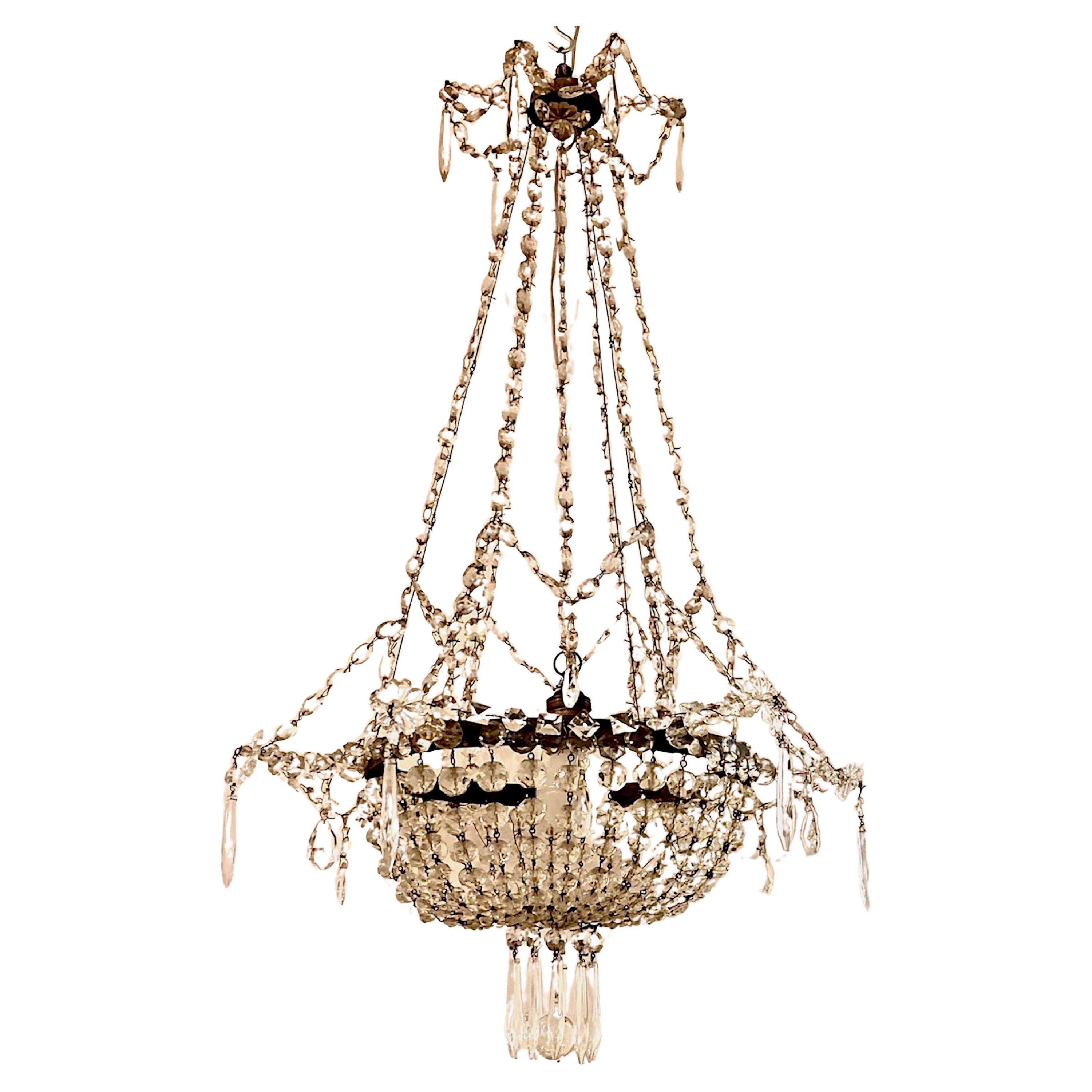 Early 20th Century French Iron and Crystal Chandelier. For Sale