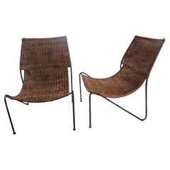 Pair of Frederick Weinberg wicker and wrought iron lounge chairs