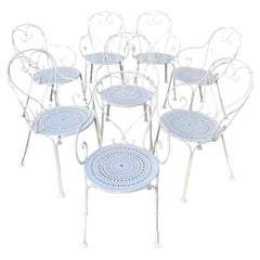 Ensemble de 8 chaises basses françaises en fer forgé