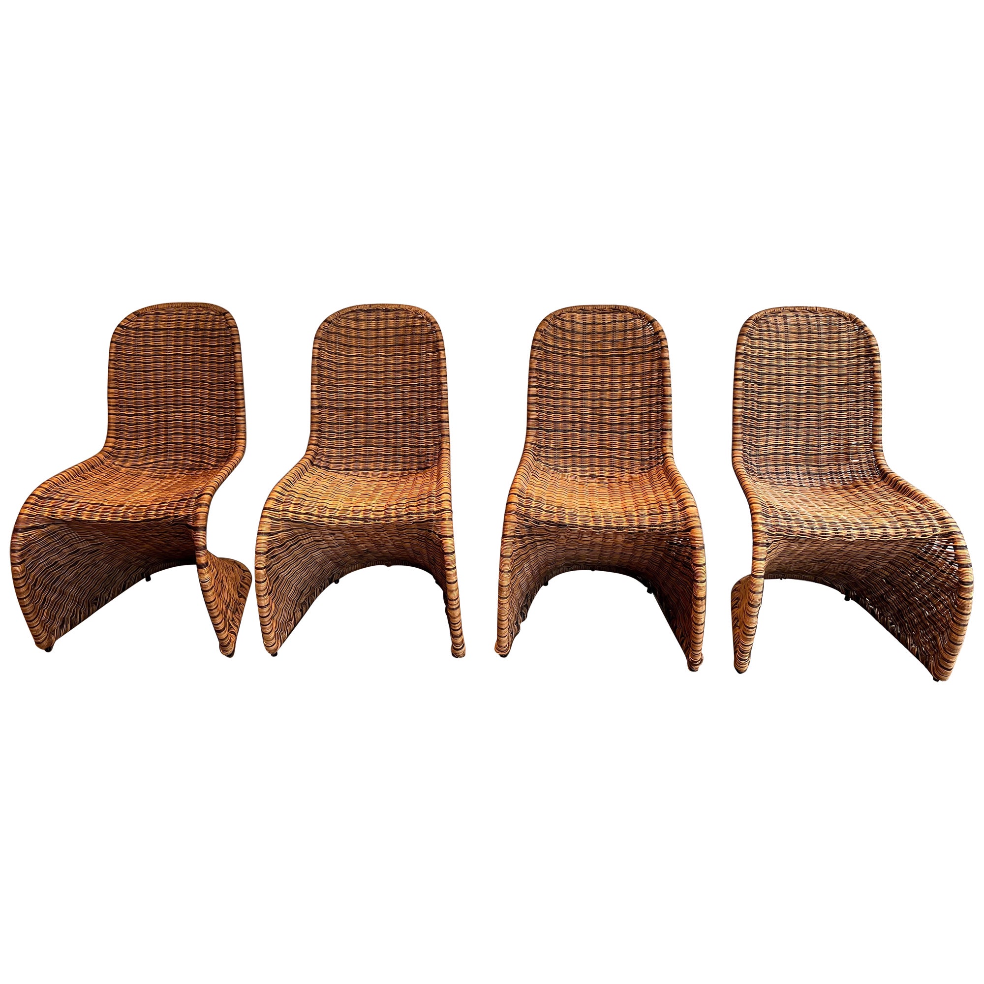 Set of Four Curved Rattan Chairs For Sale
