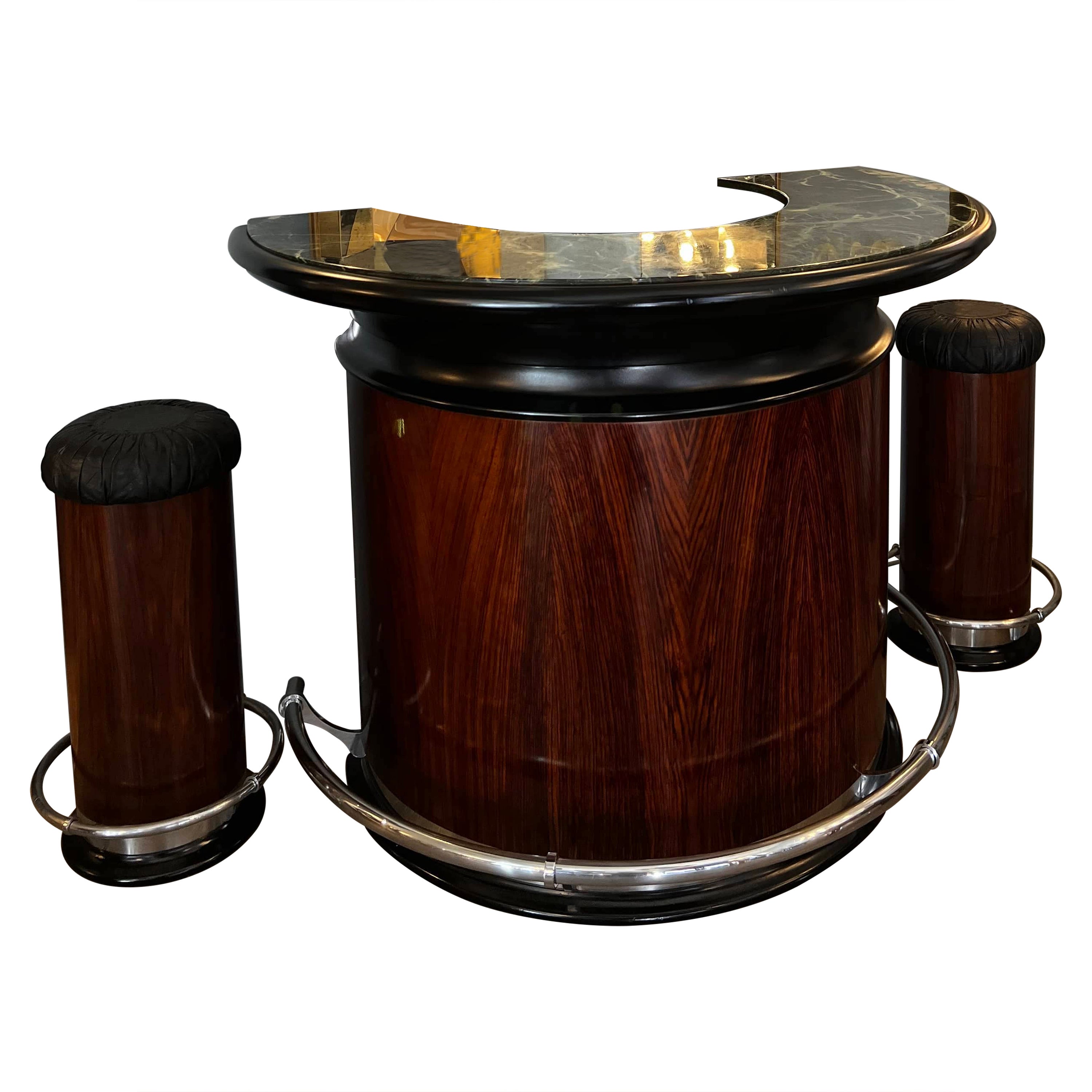 Semi-circular bar cabinet with two stools. In Art Deco style, this semi-circular-shaped counter features Verde Alpi marble top  and rosewood walls with black piping. Inside, the cabinet is organized with shelves. The two stools have faux leather