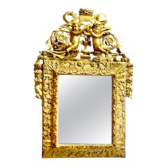 18th century gilded wood pediment mercury glass mirror decorated with putti