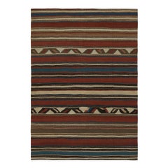 Tapis Kilim tribal vintage aux motifs géométriques polychromes par Rug & Kilim