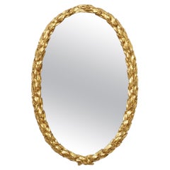 Specchio ovale in legno dorato intagliato di epoca Regency con design a foglie di alloro proveniente dall'Inghilterra