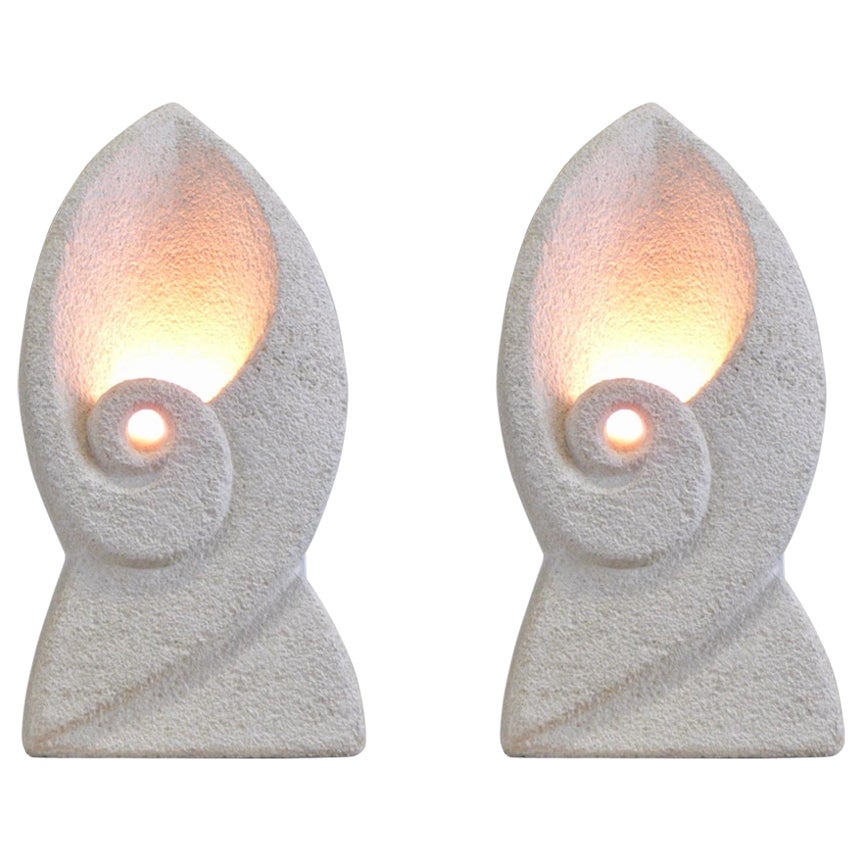 A pair of solid carved limestone lamps from the 1970s, crafted by unknown artist in France, circa 1970.

Each lamp is signed 