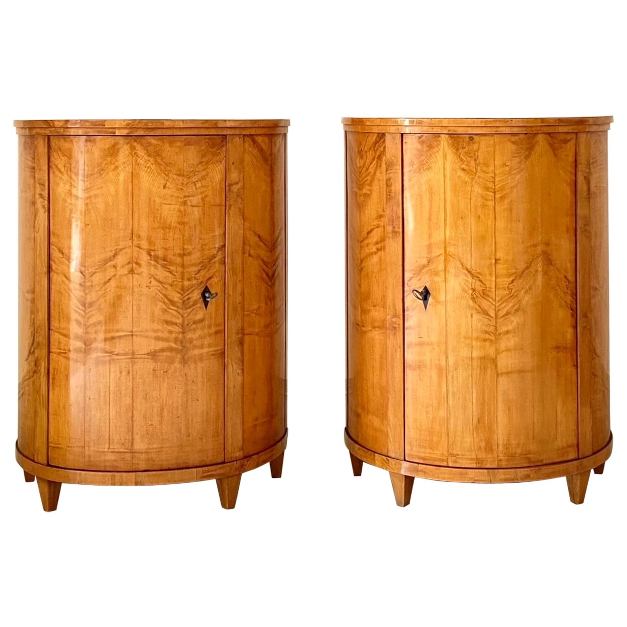 Pair of early 19th Century Biedermeier Maple Demi-lune Side Cabinets.