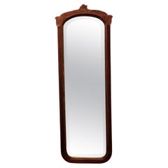 A Tall Wall Mirror, with an Arts and Crafts Frame  