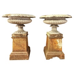 A Pair Of Antique English 19th Century Cast Iron Urns on Plinths 