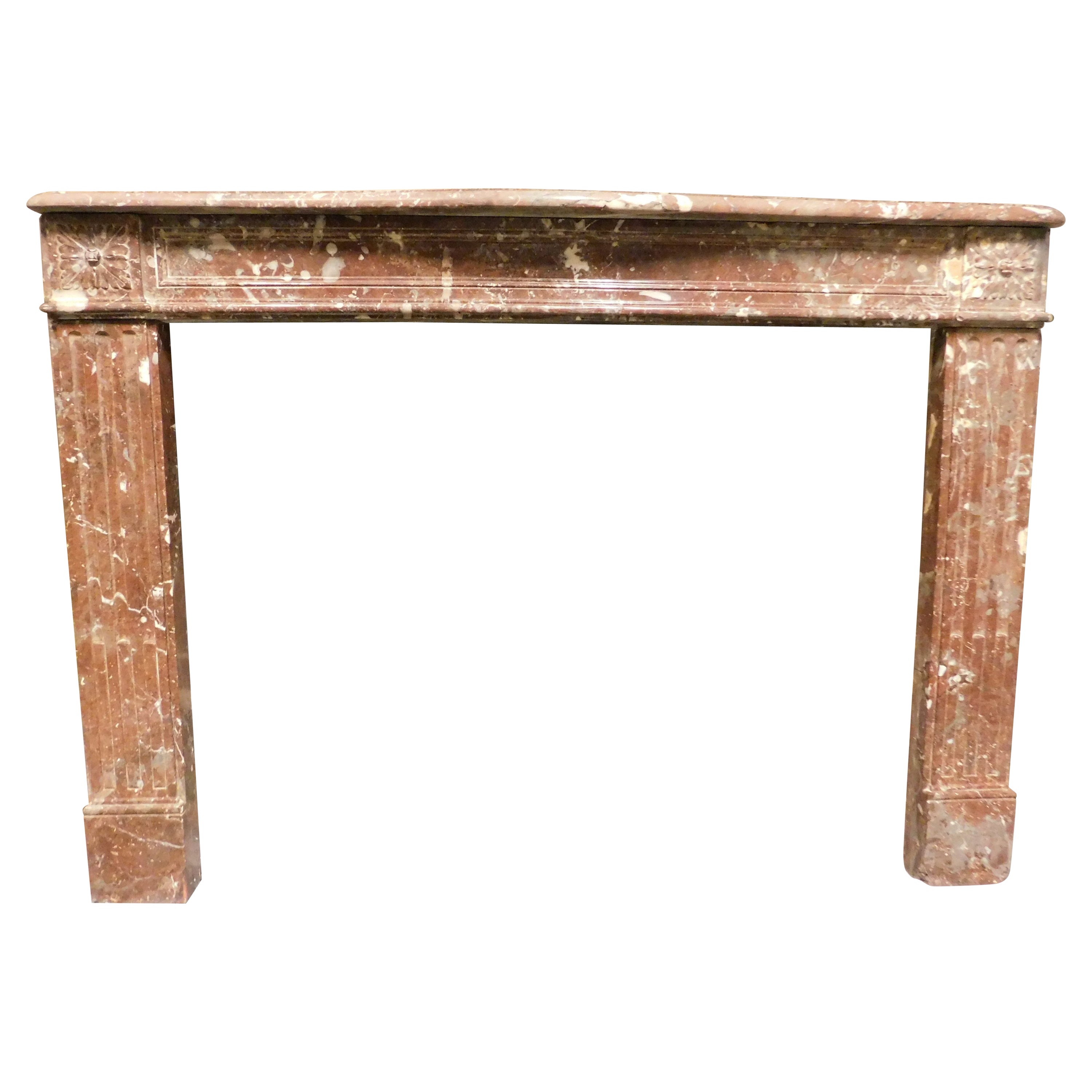 Fireplace mantel in "France Red" speckled marble with carved flowers, France For Sale