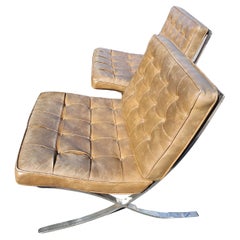 Pair of High Quality Barcelona Lounge Chairs with Brown Naughahyde Vinyl Seats