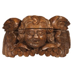 Small 18th Century French Winged Cherub in Carved Oak