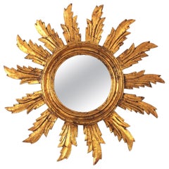 Miroir espagnol Sunburst en bois doré sculpté, années 1950