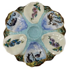 Ancienne assiette à huîtres continentale en porcelaine bleue et blanche avec natures marines, vers 1880