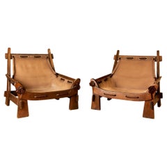 Pair of armchairs, wood and leather, circa 1970, France.