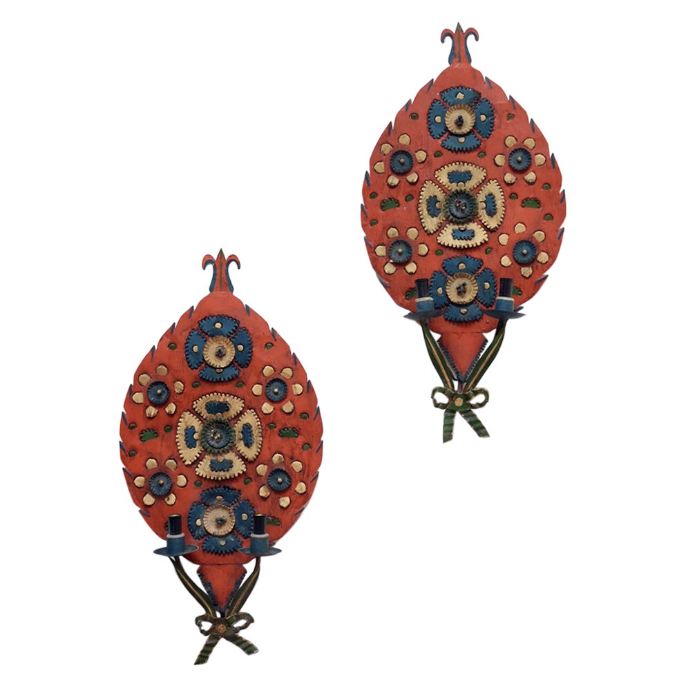 Pair of folk art sheet metal wall lamps, 1950s.