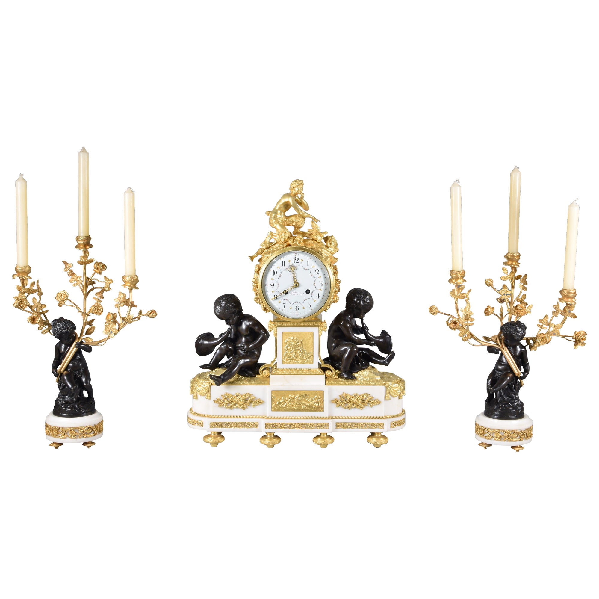 Clock and candelabra garniture. Paris, France, second half 19th century.