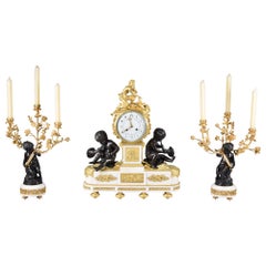 Antique Clock and candelabra garniture. Paris, France, second half 19th century.