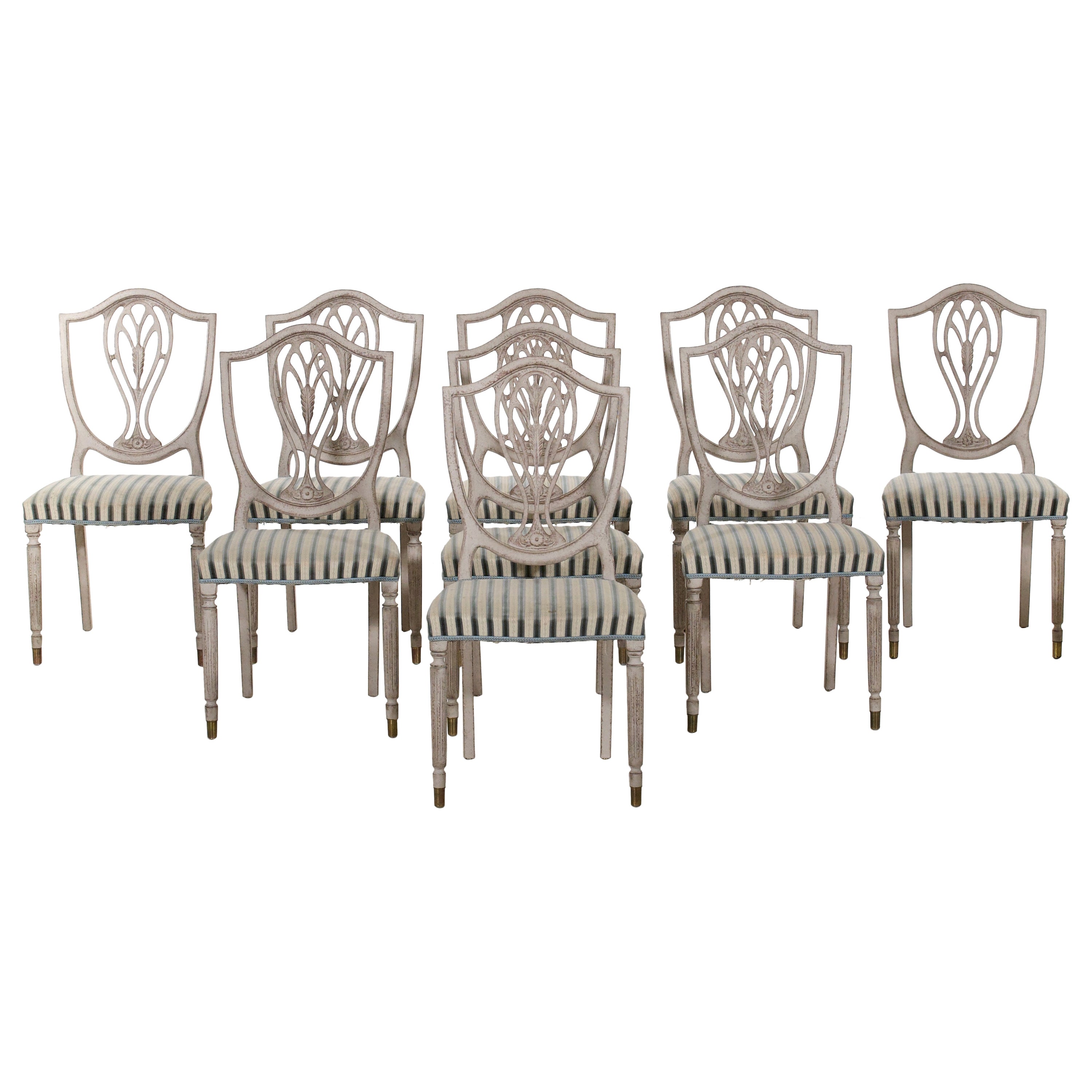 Charming European set of nine dining room chairs, 20th C.