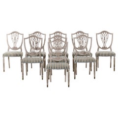 Charming European set of nine dining room chairs, 20th C.