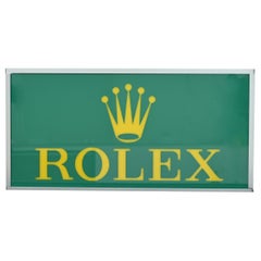 Signage publicitaire ROLEX des années 1990 avec éclairage jaune