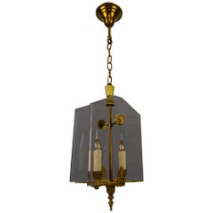 Lámpara colgante de dos luces de cristal y bronce estilo Imperio francés, años 50