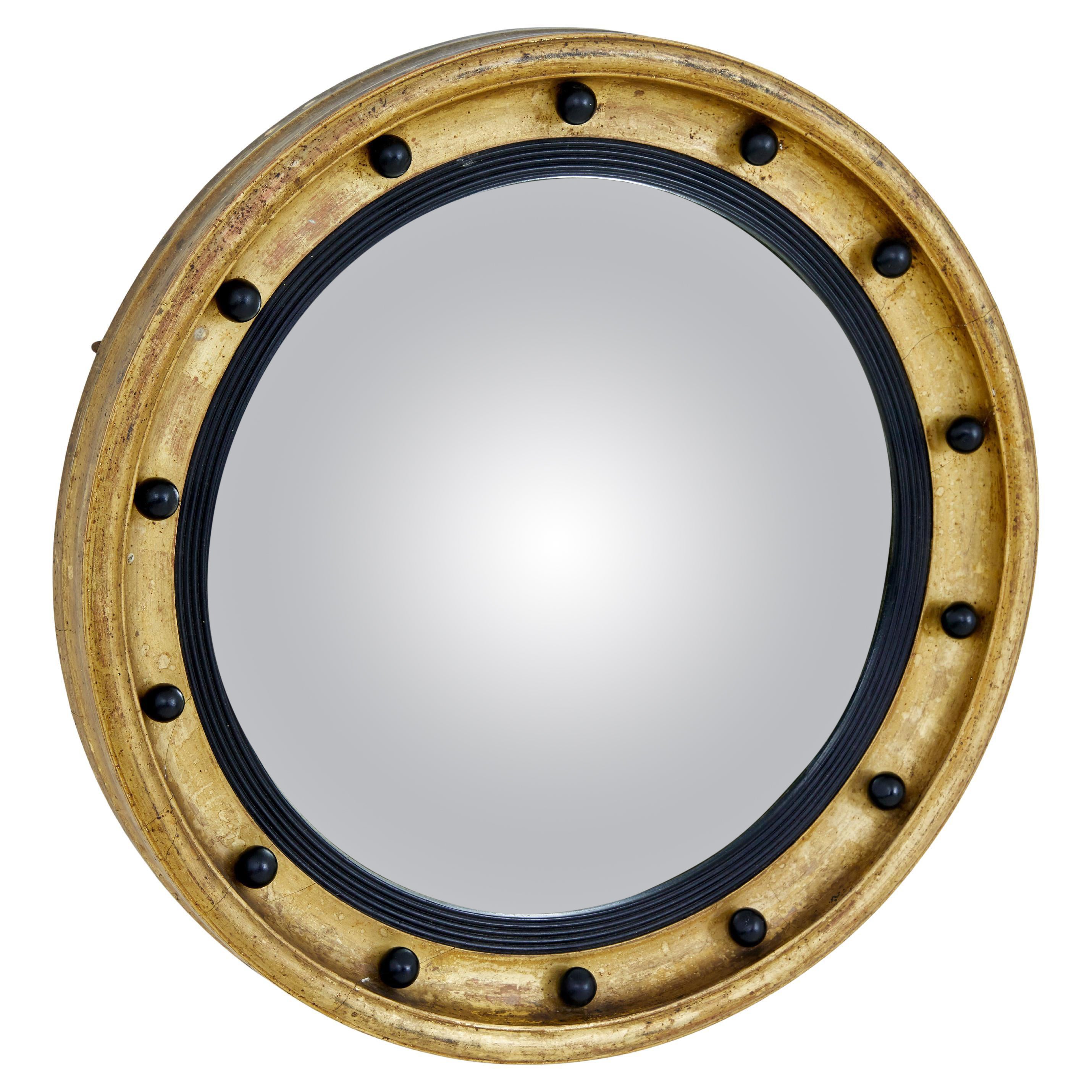 19th century ebonised and gilt convex mirror