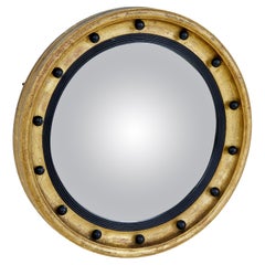 Konvexer Spiegel aus dem 19. Jahrhundert, ebonisiert und vergoldet