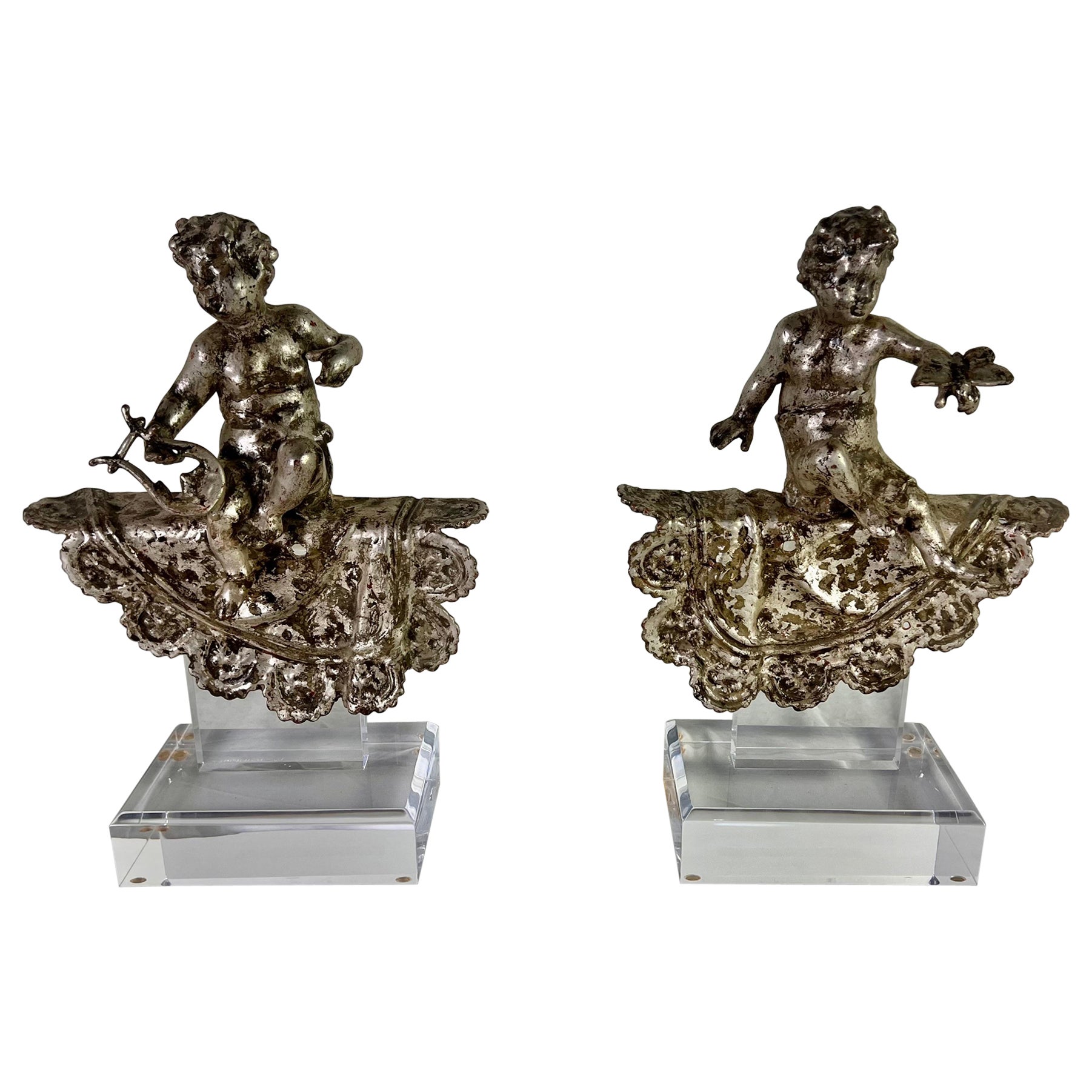Pair of French Silvered Gilt Metal Cherubs on Lucite Bases For Sale