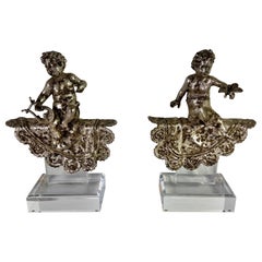 Pair of French Silvered Gilt Metal Cherubs on Lucite Bases