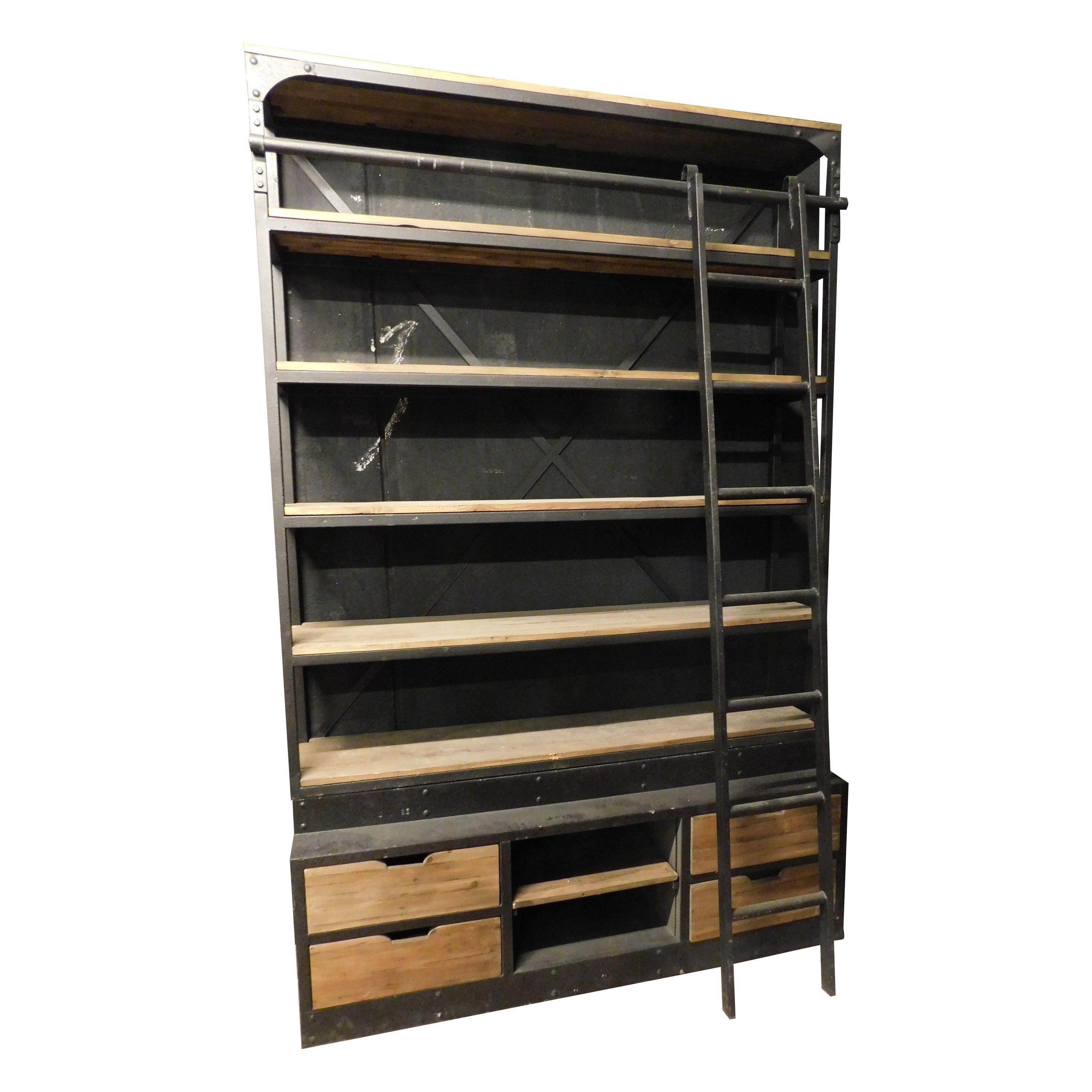 Industrial iron bookcase with wooden shelves and drawers complete with ladder For Sale