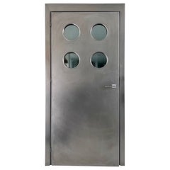 Used Contemporary custom made Spinzi stainless steel metal door with round portholes