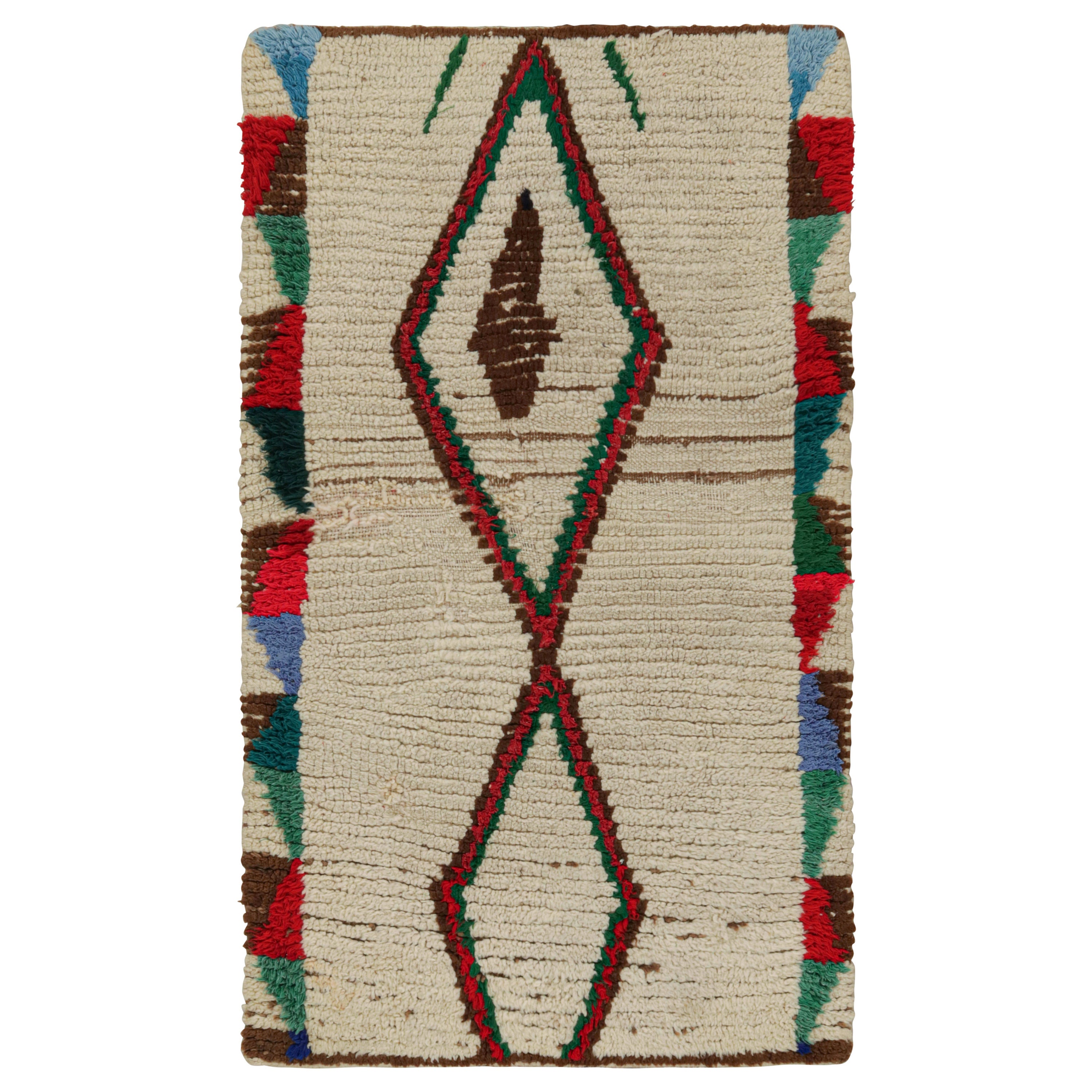 1950s Azilal Moroccan rug in Beige with Red-Green Patterns by Rug & Kilim For Sale