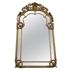 Miroir sculpté et doré de style Louis XV du 19ème siècle 