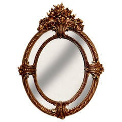 Grand miroir ovale de style Louis XV français du 19ème siècle, sculpté et doré