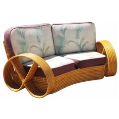 Restored Rattan 6 Strand Full Pretzel Curved Settee, in the style of Paul Frankl