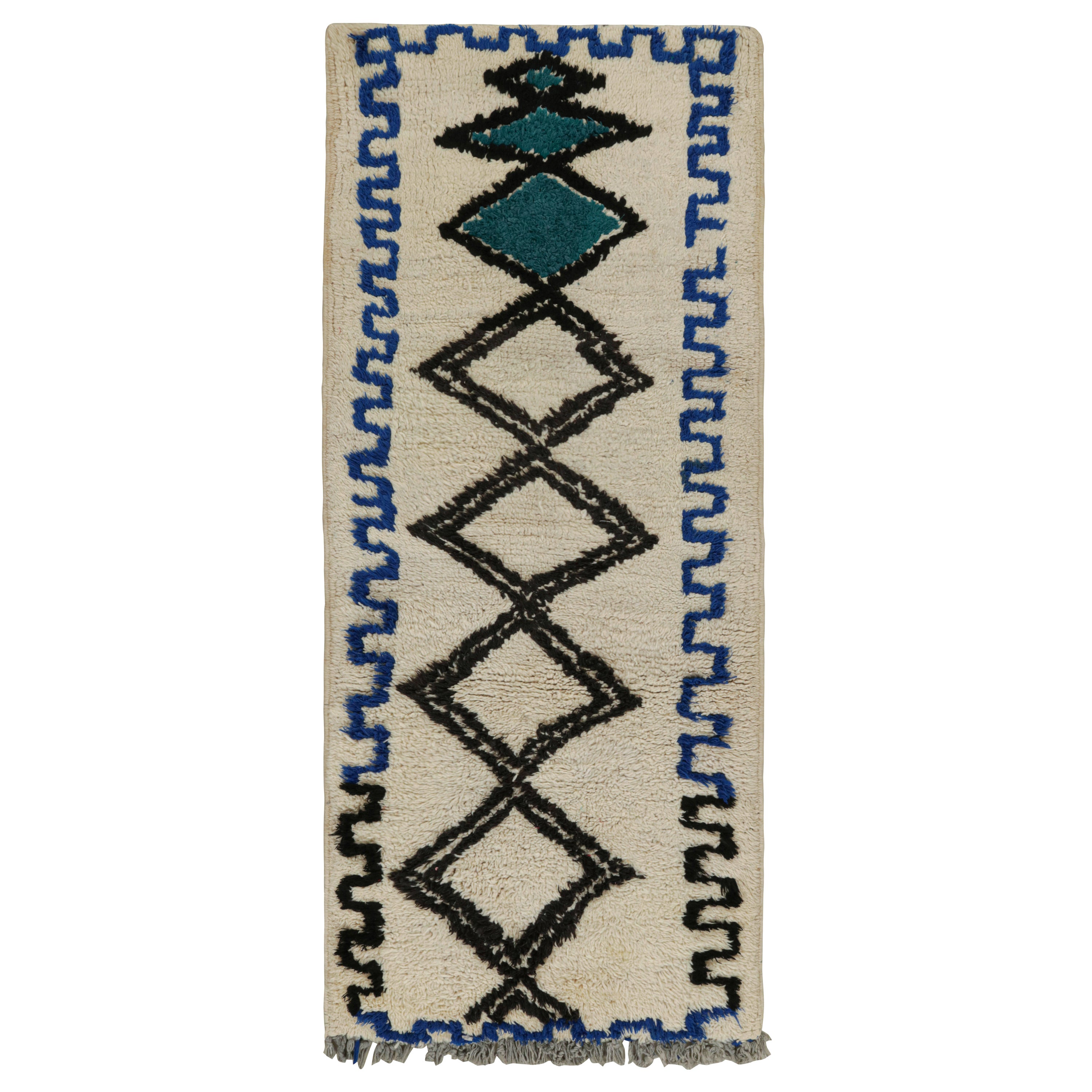 1950s Azilal Moroccan rug in White with Blue-Black Patterns by Rug & Kilim For Sale