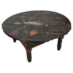 Vintage Black Moroccan Round Table With Primitive Illustrations.